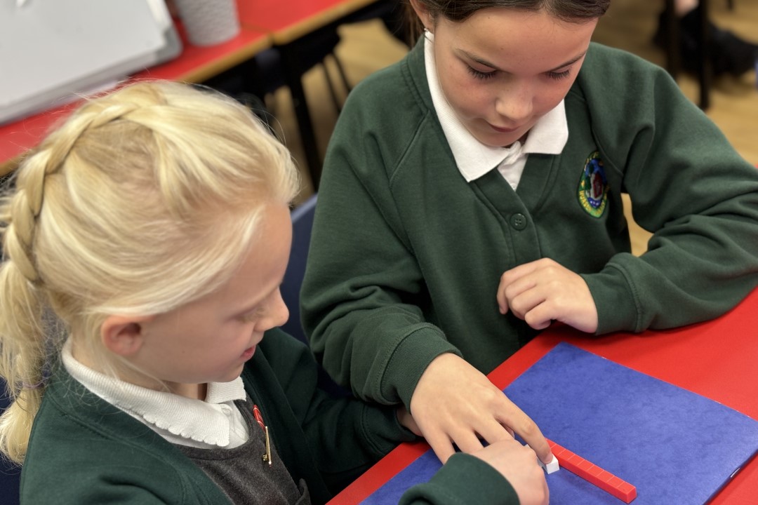 two-children-working-together-in-classroom
